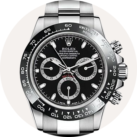 Montre Rolex Cosmograph Daytona sur un fond beige.